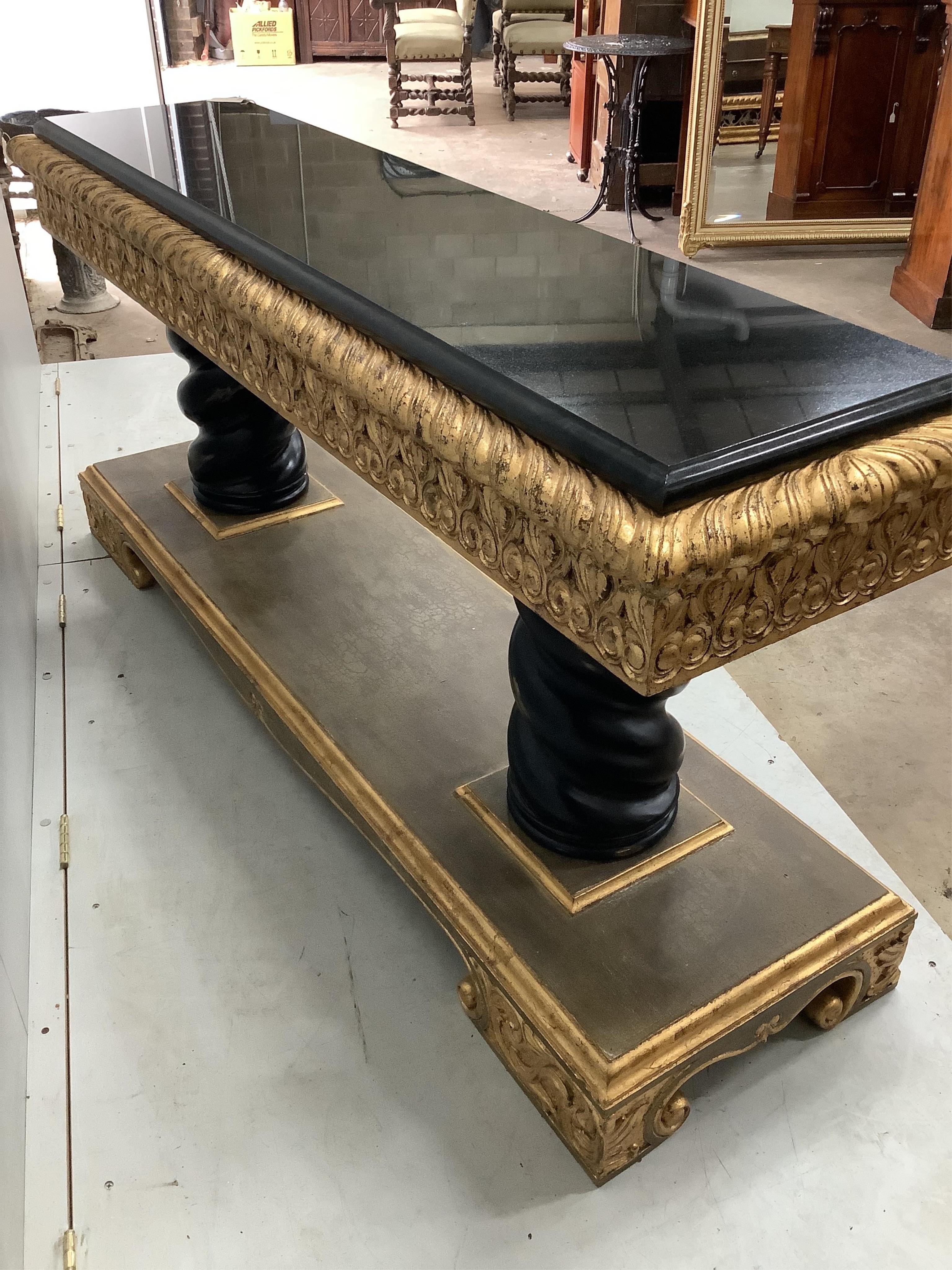 A Harrison Gil parcel gilt console table with marble inset top, width 180cm, depth 51cm, height 85cm and matching ornate wall mirror, width 138cm, height 165cm. Condition - fair to good, some minor chipping